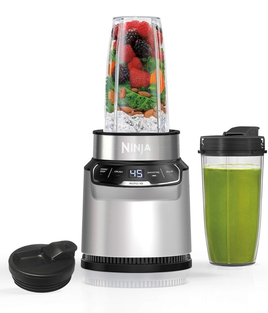 Ninja Nutri Pro Compact Personal Blender with smoothie cup, green juice, and personal lid on white background