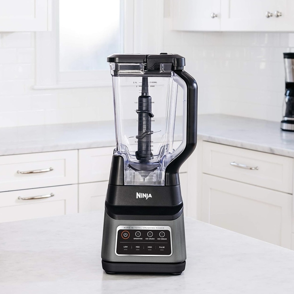 Ninja BN701 Professional Plus Blender on white kitchen counter with clear pitcher and black control panel